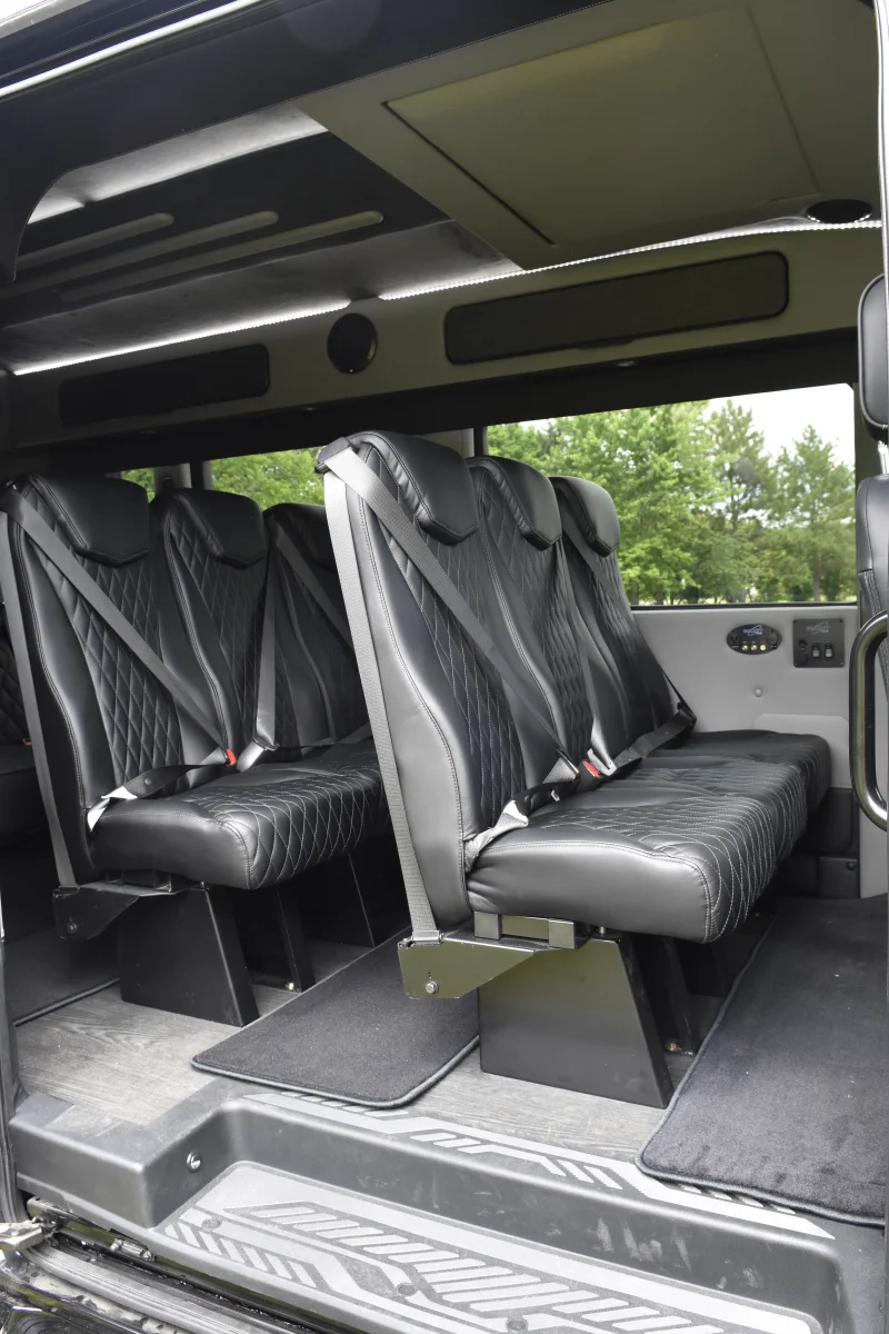 Custom Shuttle Luxury Van Galaxy interior with Shuttle Seating 11 Passenger 148 Medium Roof rear Sofa folds into Bed By Waldoch by Waldoch Crafts
