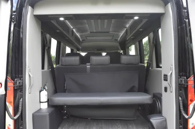 CUSTOM SHUTTLE LUXURY VAN GALAXY INTERIOR WITH SHUTTLE SEATING 11 PASSENGER 148 MEDIUM ROOF REAR SOFA FOLDS INTO BED BY WALDOCH - 2019 FORD TRANSIT GALAXY - Image 11 of 41