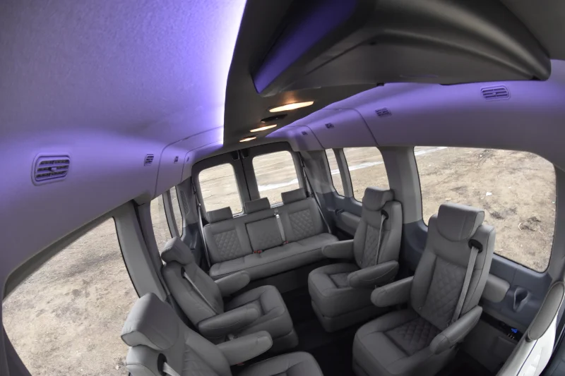 LandMark 9 Passenger Luxury 148 Medium Roof Ford Transit By Waldoch Silver Exterior and Graphite Seating by Waldoch Crafts